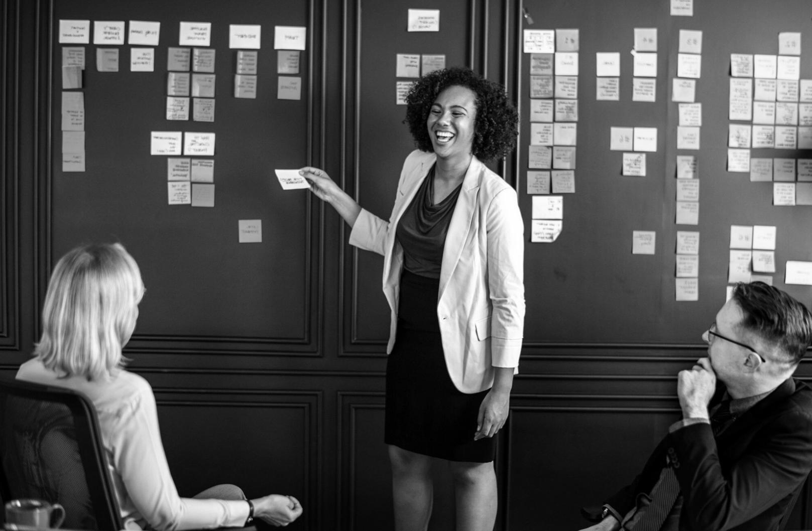 Team meeting discussing project budget allocation and tracking methods